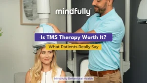 A clinician adjusting a Transcranial Magnetic Stimulation (TMS) helmet on a female patient during a therapy session, representing patient perspectives on TMS treatment.