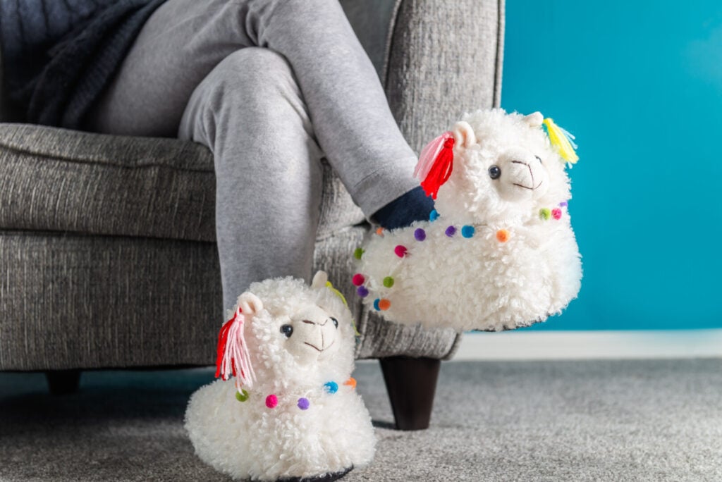 Adult woman wearing comfy bunny slippers while getting effective online therapy from Ohio