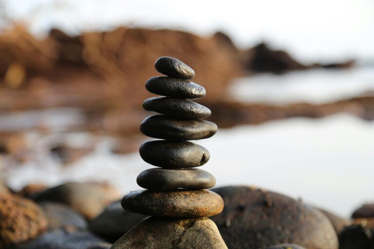 Stacked rocks representing mindfulness support group for people who feel stressed, overwhelmed or would just like to join a free a guided meditation session each week.