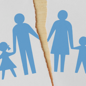 A family holds hands while displaying a paper with a silhouette of themselves together.