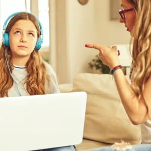 Parent calmly talking to an angry teen