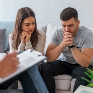 Distant couple highlighting signs for couples counseling.