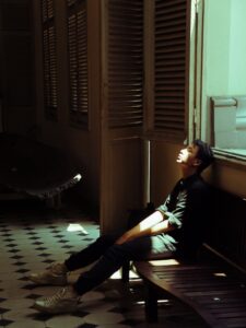 A man on a bench in a room