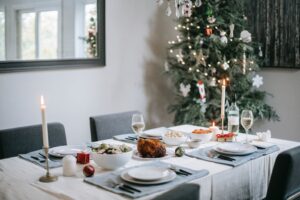 A festive Christmas dinner table set with decorations