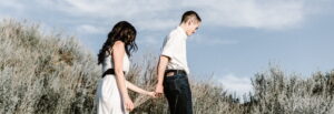 A man and woman holding hands