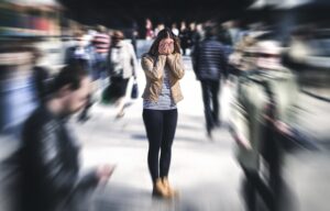 A woman walks through a crowded area