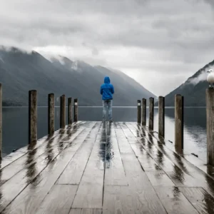 A person stands on a dock