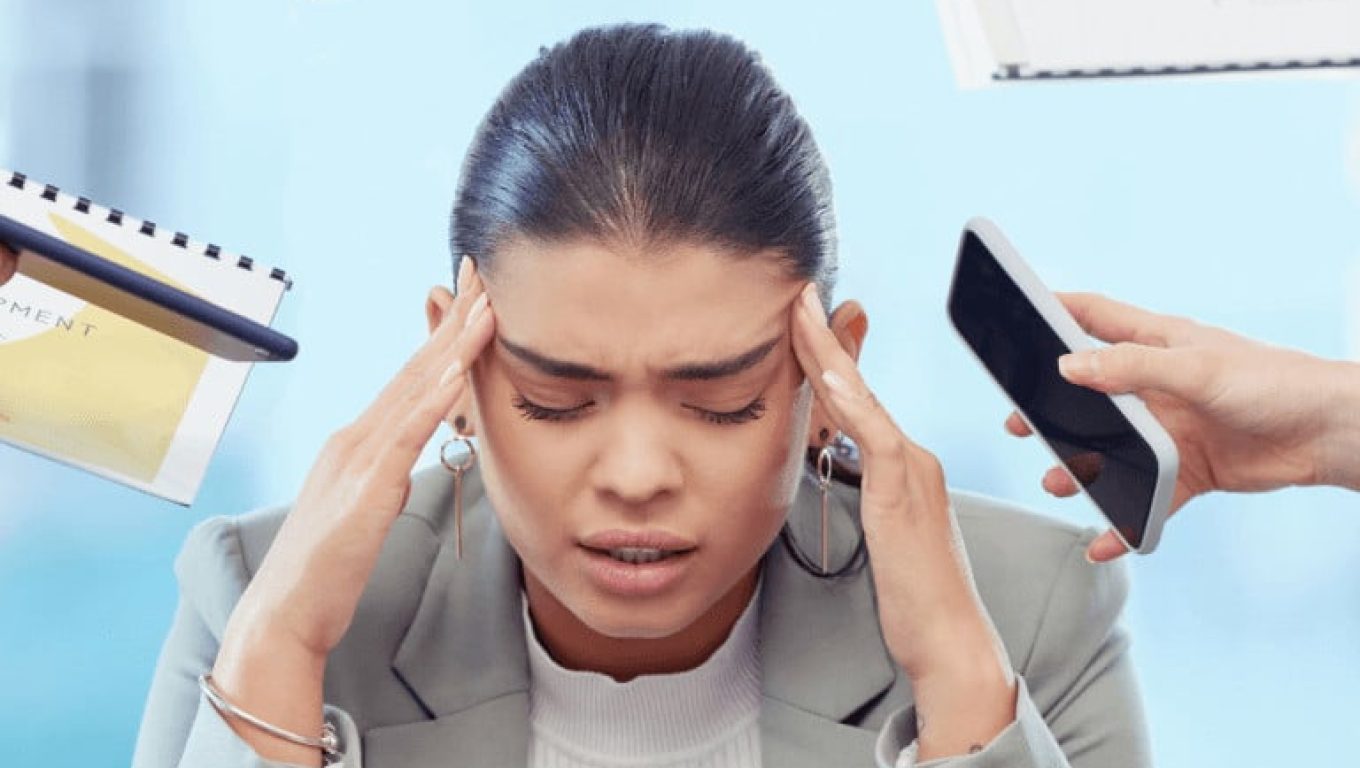 A woman with her head in her hands