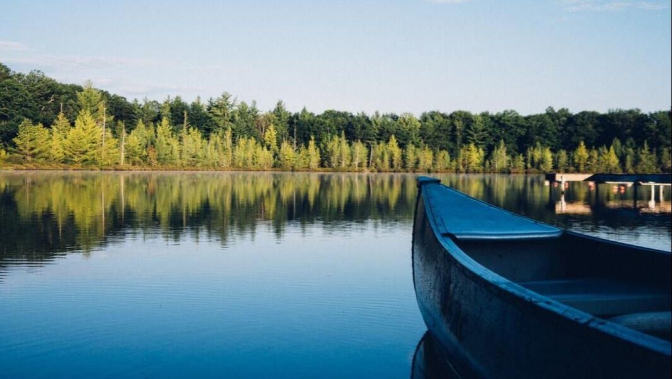 A canoe floats on calm water
