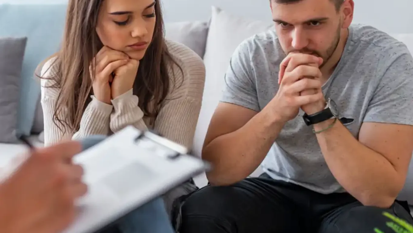 Distant couple highlighting signs for couples counseling.